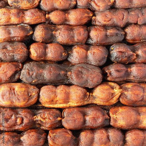 The sweet, spicy pulp of the fruit of the tamarind tree