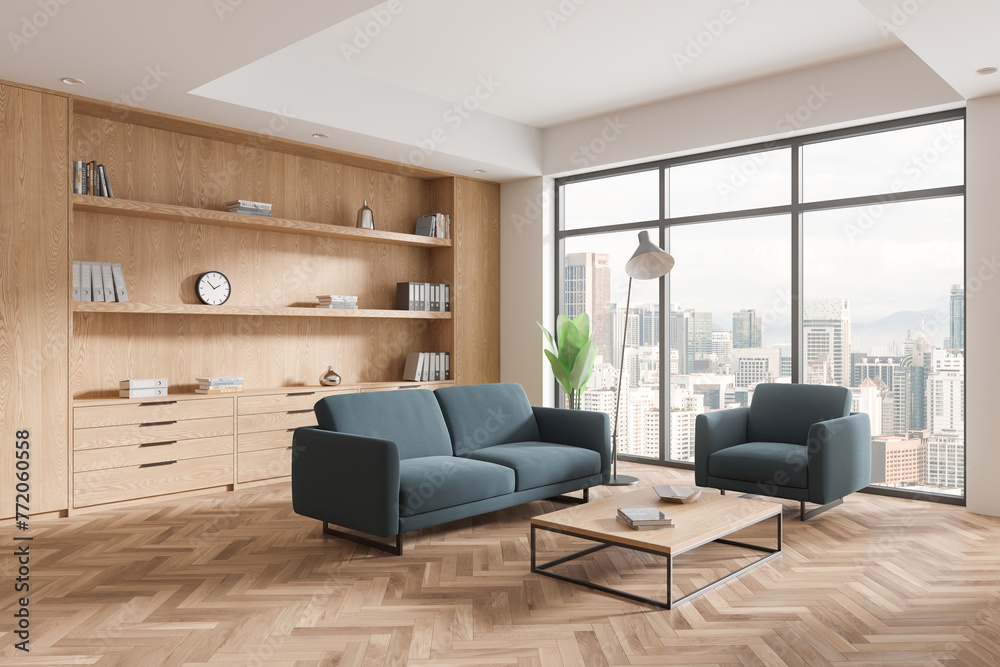 Stylish office lounge zone interior with sofa and shelf, panoramic window Stylish office lounge zone interior with sofa and shelf, panoramic window