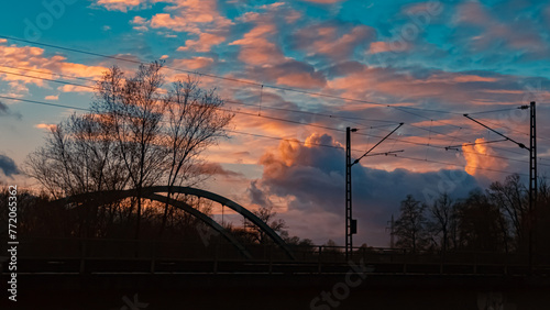 Sunset with a bridge silhouette near Plattling, Isar, Bavaria, Germany