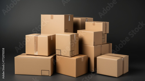 A set of brown cardboard boxes on a black background. © crazyass