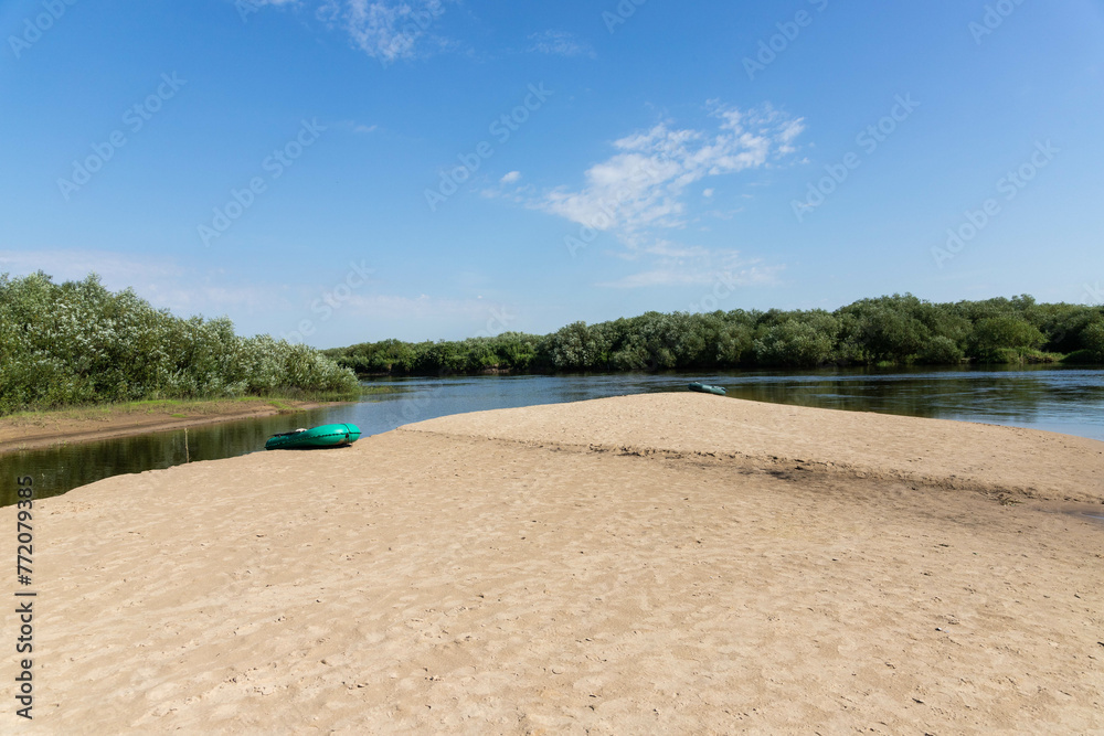 Inflatable boat on the background of the river and nature. Travel concept, rafting, rafting. Inflatable boat on the background of the river and nature. Travel concept, rafting, rafting.