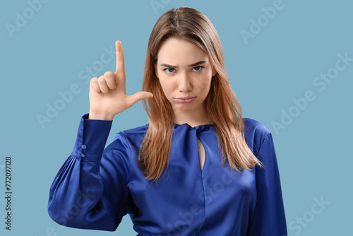 Upset young woman showing l...