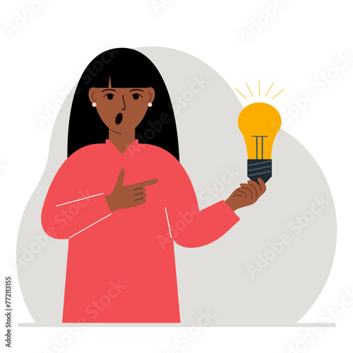 A woman holds a light bulb in his hand. Idea concept, brainstorming, business, thinking, solution, eureka, task, bingo or answer search.