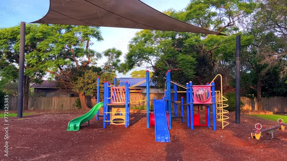 colourful Kids park with swings and slides yellow and blue shades in Suburban western Sydney NSW Australia
