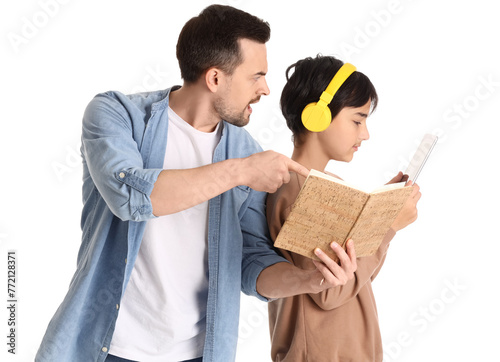 Angry father pointing at bo...
