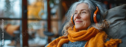 old woman listens music on headphones. relax, self care, contemporary concept.  banner