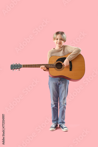 Cute little boy playing gui...