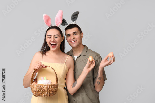 Joyful couple in bunny ears...
