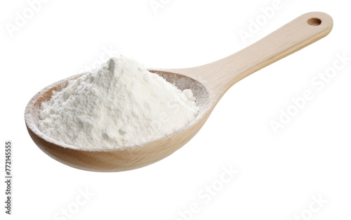 A wooden spoon holding a mysterious white powder