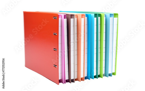 A collection of various colored binders, neatly arranged in a row on a desk