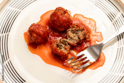 Meatballs in tomato sauce on a plate. Top view.