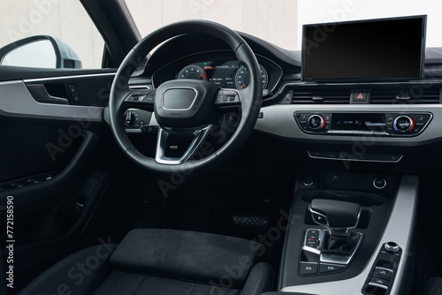 Modern expensive car interior with leather panel, sport seats, multimedia and digital dashboard © Moose
