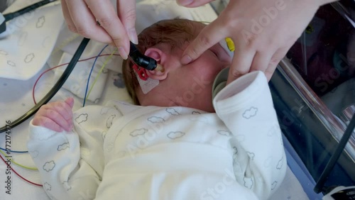 Newborn Infant Hearing Screening. At the hospital, the newborn baby is tested for hearing.