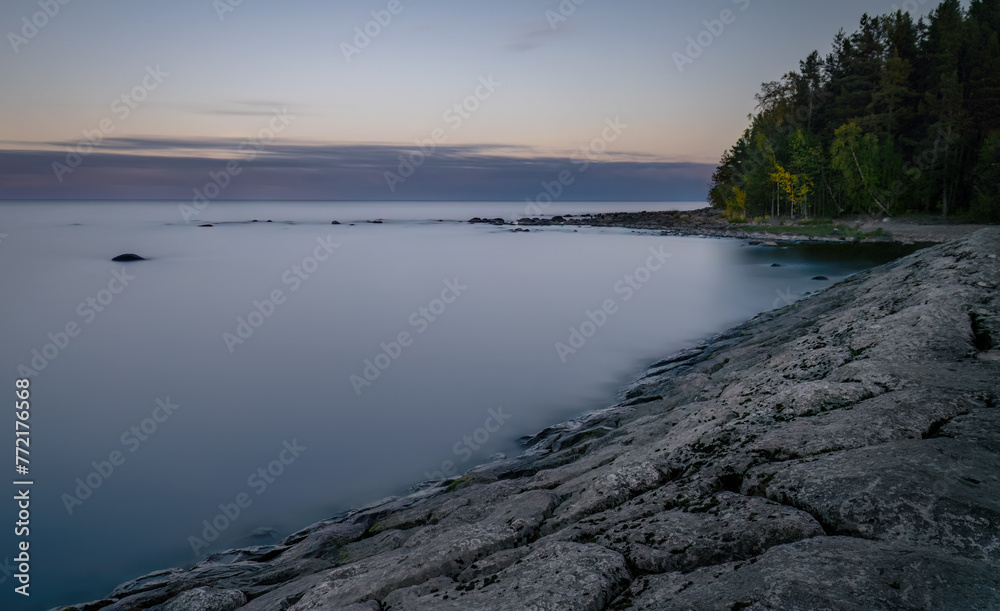 Long exposure of a lake at sunset. Russia Karelia Long exposure of a lake at sunset. Russia Karelia