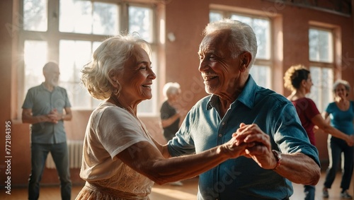 Happy senior couple, man and woman, dancing a passionate Bachata dance in the studio. photo