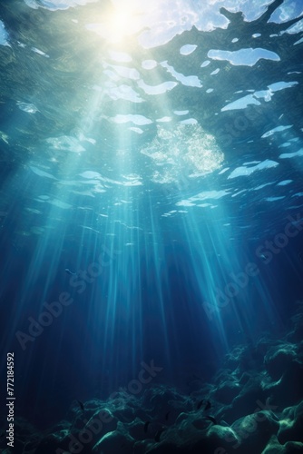 A beautiful blue ocean with sunlight shining through the water. The sunlight creates a serene and peaceful atmosphere  making the scene feel calm and relaxing. The water is clear and deep