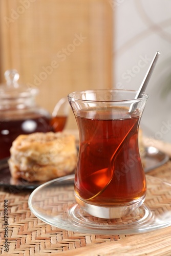 Traditional Turkish tea in glass on wicker table