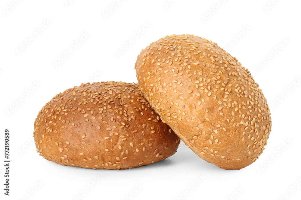 Two fresh hamburger buns with sesame seeds isolated on white Two fresh hamburger buns with sesame seeds isolated on white