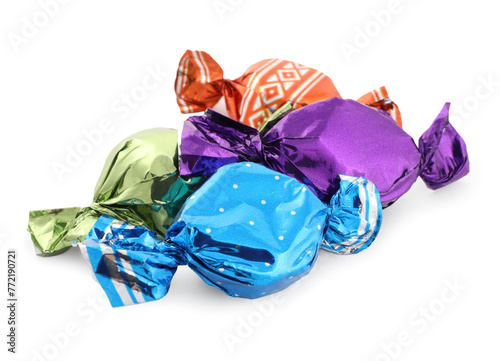 Sweet candies in colorful wrappers on white background
