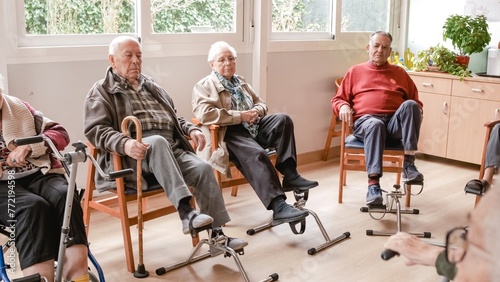 Senior people doing pedal exercises at rehabilitation center photo