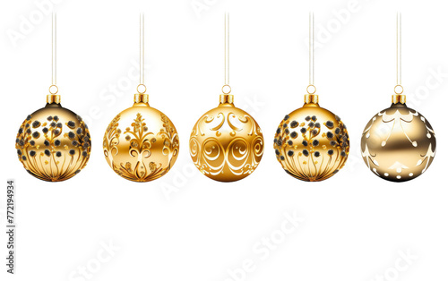 Shimmering gold Christmas ornaments dangle gracefully on strings in a decorative row