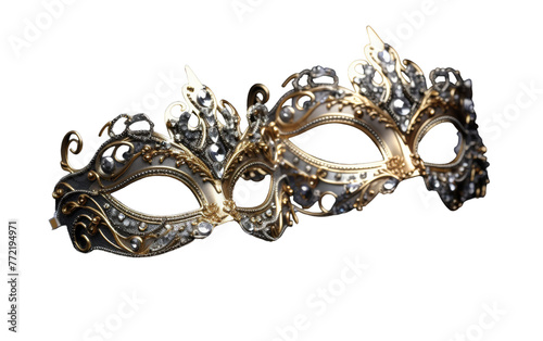 A black and gold masquerade mask stands out against a white background