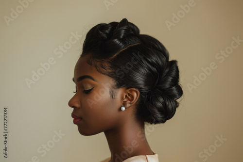 Sophisticated and elegant woman with updo hairstyle, chic bun, and pearl earrings on neutral background photo