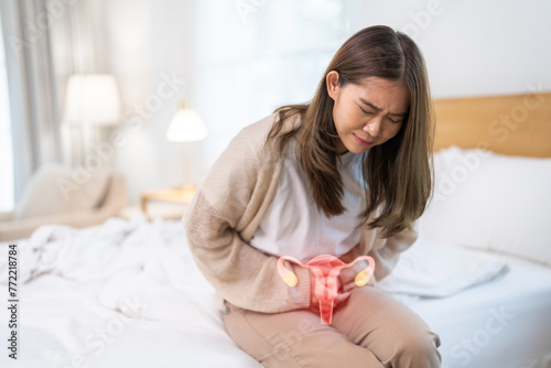 Woman sick unhappy holding uterus pain, reproductive system, HPV, papillomavirus, HPV vaccine, cervical cancer, stomach ache, monthly period, Woman healthcare photo