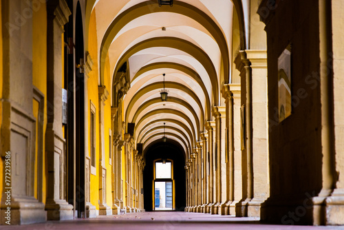 Low angle view of the Colonnade Archway of the Stiftung Juliusspital Hospital, Wurzburg, Franconia, Bayern, Germany. Baroque Walkway Arches Architecture Details. Sightseen Wallpaper. photo