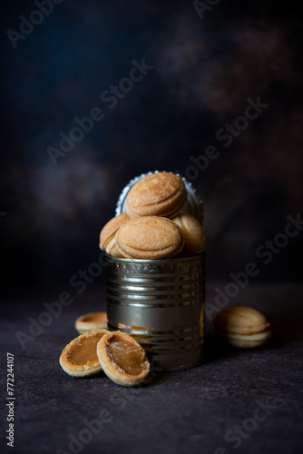 Delicious homemade cookies nuts with boiled condensed milk in a tin can