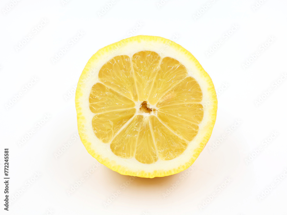 Slice of lemon isolated on white background. Flesh of a yellow citrus fruit in close-up.