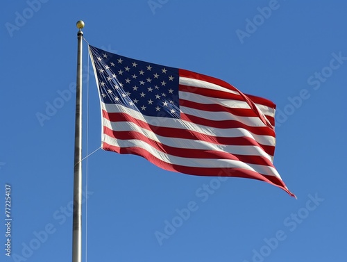 A large American flag is flying in the sky. The flag is red, white, and blue and has stars on it. The flag represents the United States