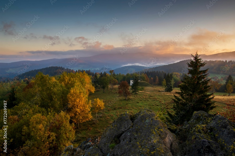 Tranquil scene of a grassy meadow and trees at sunset. Kremnica Mountains, Slovakia. Tranquil scene of a grassy meadow and trees at sunset. Kremnica Mountains, Slovakia.