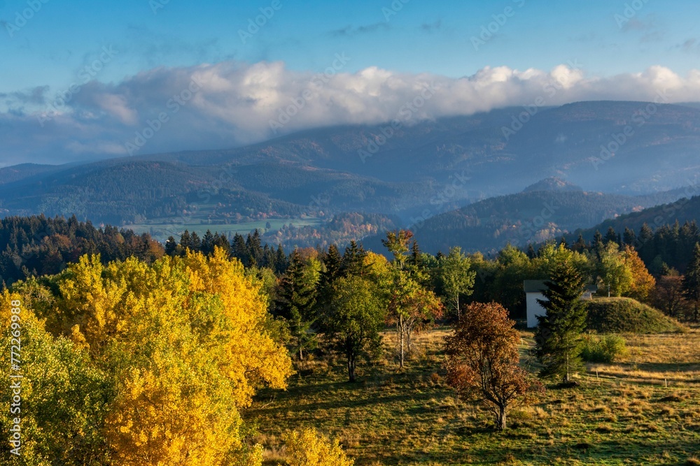 Tranquil scene of a grassy meadow with colorful trees. Kremnica Mountains, Slovakia. Tranquil scene of a grassy meadow with colorful trees. Kremnica Mountains, Slovakia.