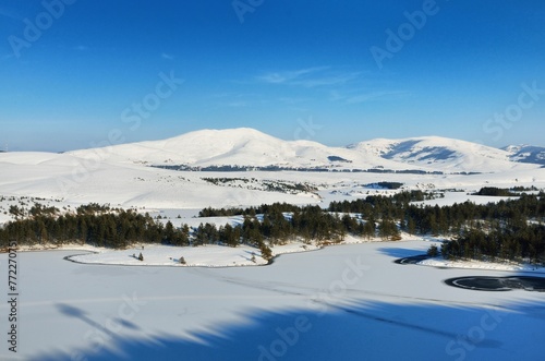 Scenic view of hills covered with snow in winter