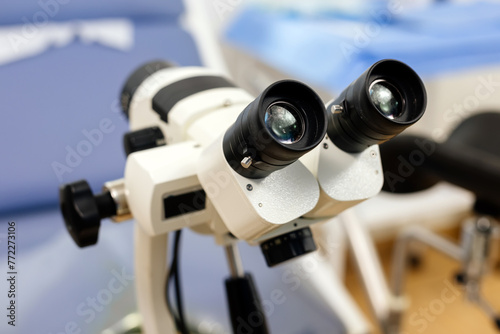 Close-up of a gynecological office with a colposcope near a gynecological chair in a modern hospital. Concept of pregnancy, modern medicine and medical technology.