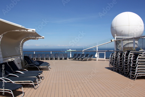 On the upper deck of a large ocean liner.