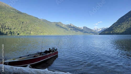 Fishing boat on Chilliwack Lake with majestic mountains in the background. BC, Canada.