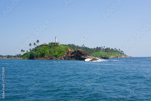 Breathtaking view of a deep blue turquoise ocean in a beautiful tropical island in Sri Lanka photo