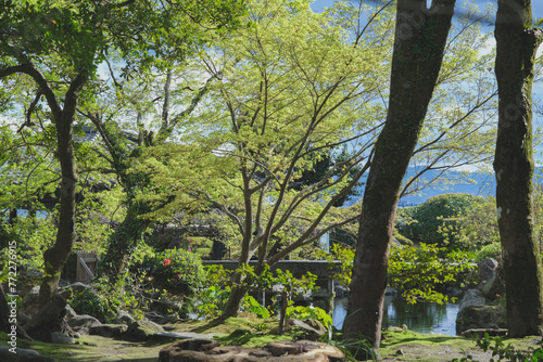 Sengan-en Japanese garden with former Shimazu clan residence in Kagoshima Prefecture, Japan. Place of scenic landscape beauty with Shōko Shūseikan Meji Revolution Sakurajima lookout volcano view