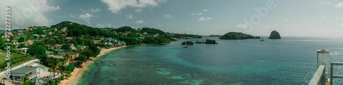 Stunning aerial view of a lush, green tropical St. Lucia island surrounded by crystal-clear ocean