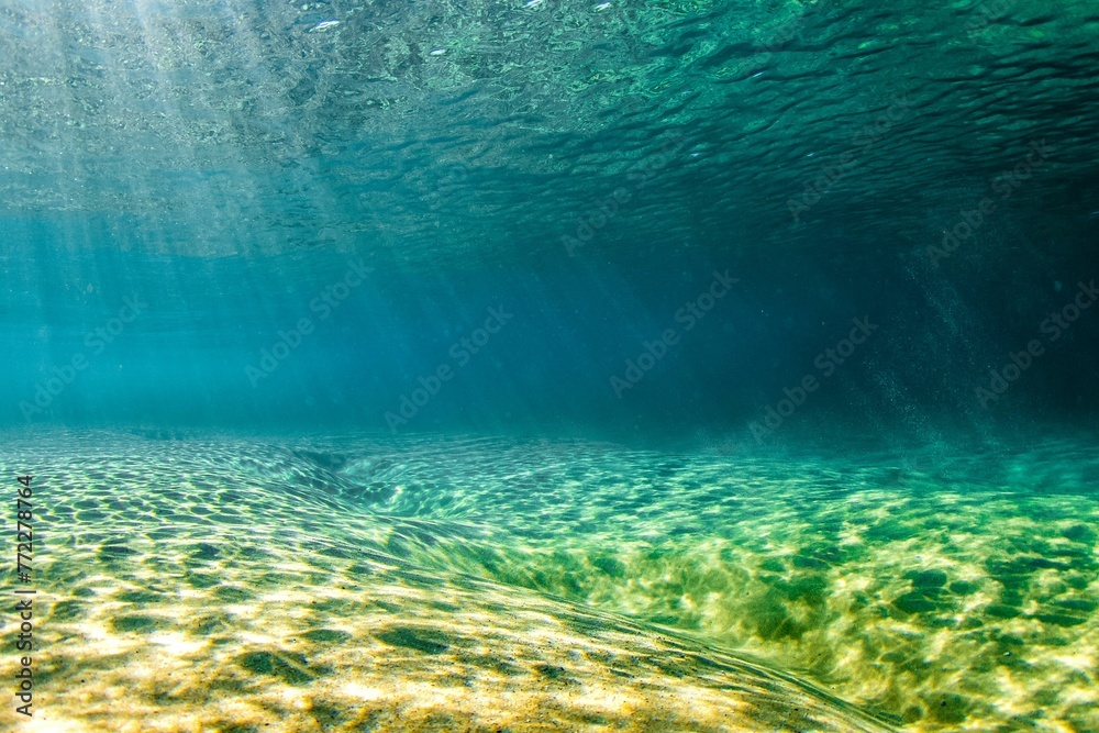 Tranquil ocean underwater area reflecting the sunlight