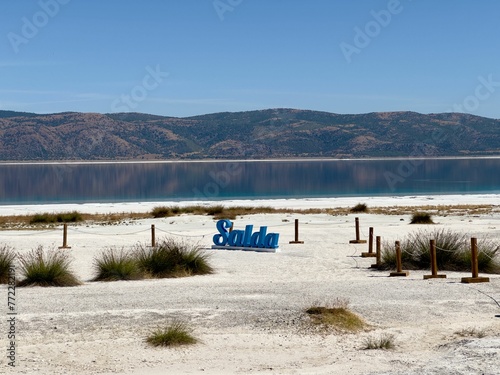 Closeup of  Burdur Salda Lake under the blue sky in  Saldives, Turkey photo