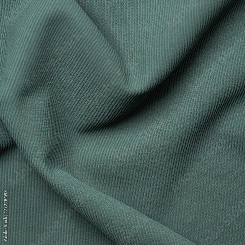 Close-up of textured green fabric background. High resolution photo.