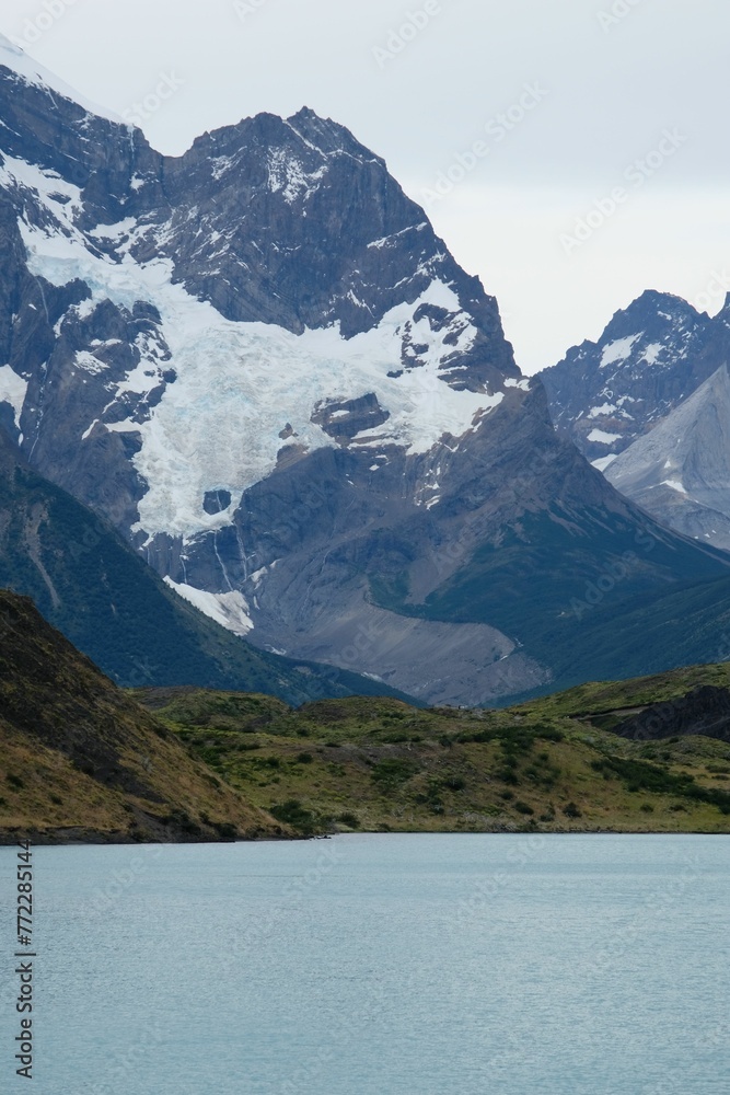 Snow-capped mountains standing tall against a beautiful blue sky in Torres del Paine National Park Snow-capped mountains standing tall against a beautiful blue sky in Torres del Paine National Park