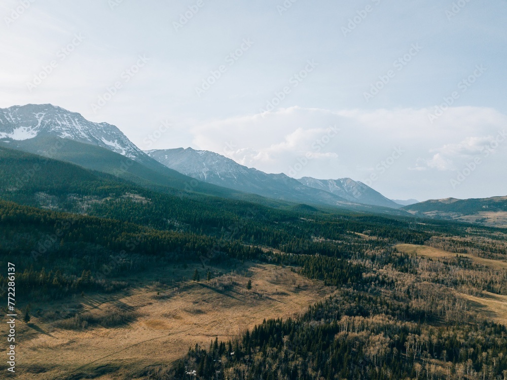 Scenic view of majestic mountains on the horizon during the day in Alberta Canada Scenic view of majestic mountains on the horizon during the day in Alberta Canada