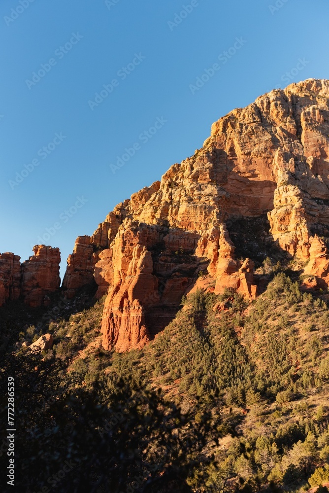Mesmerizing view of the iconic red rock formations of Sedona, Arizona against a bright blue sky
