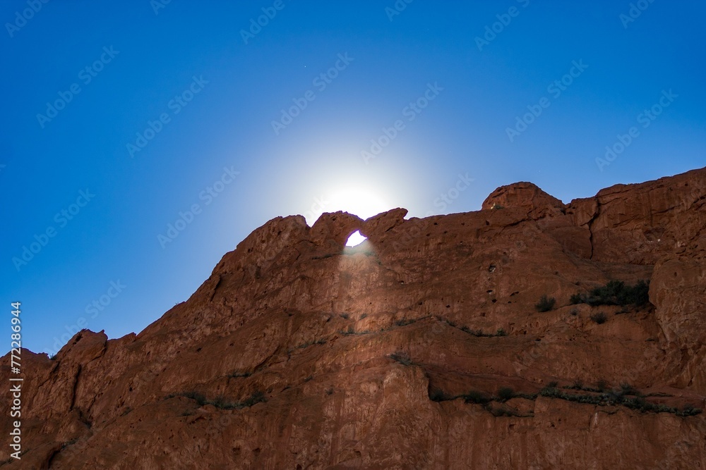 Brreathtaking view of the towering Garden of the Gods rock formations illuminated by the sun