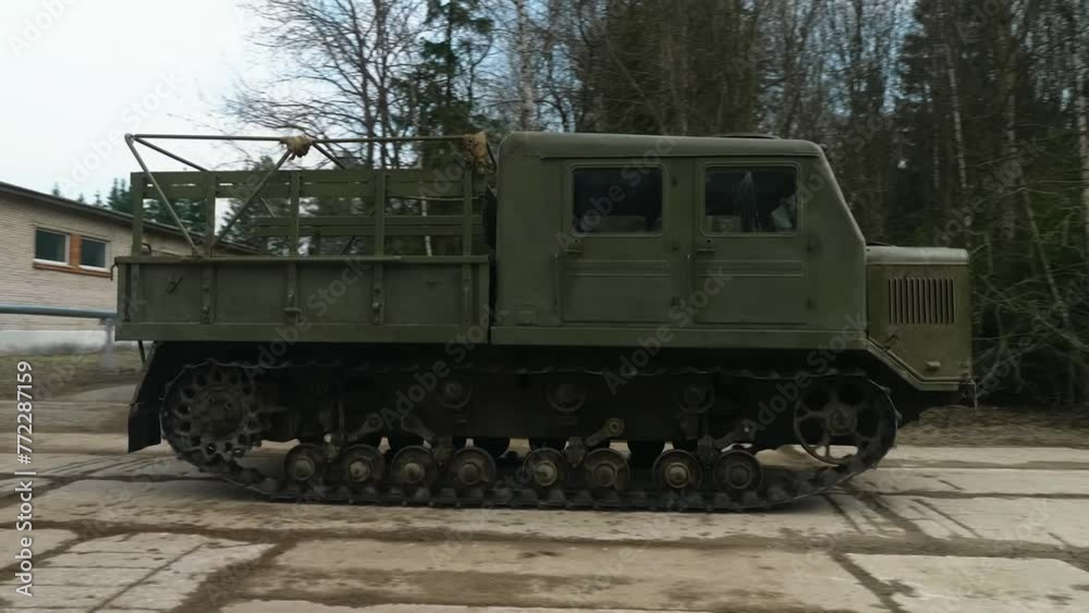 Soviet medium-track artillery tractor from the mid-20th century, designed for towing trailers, transporting people, and cargo. Soviet medium-track artillery tractor from the mid-20th century, designed for towing trailers, transporting people, and cargo.