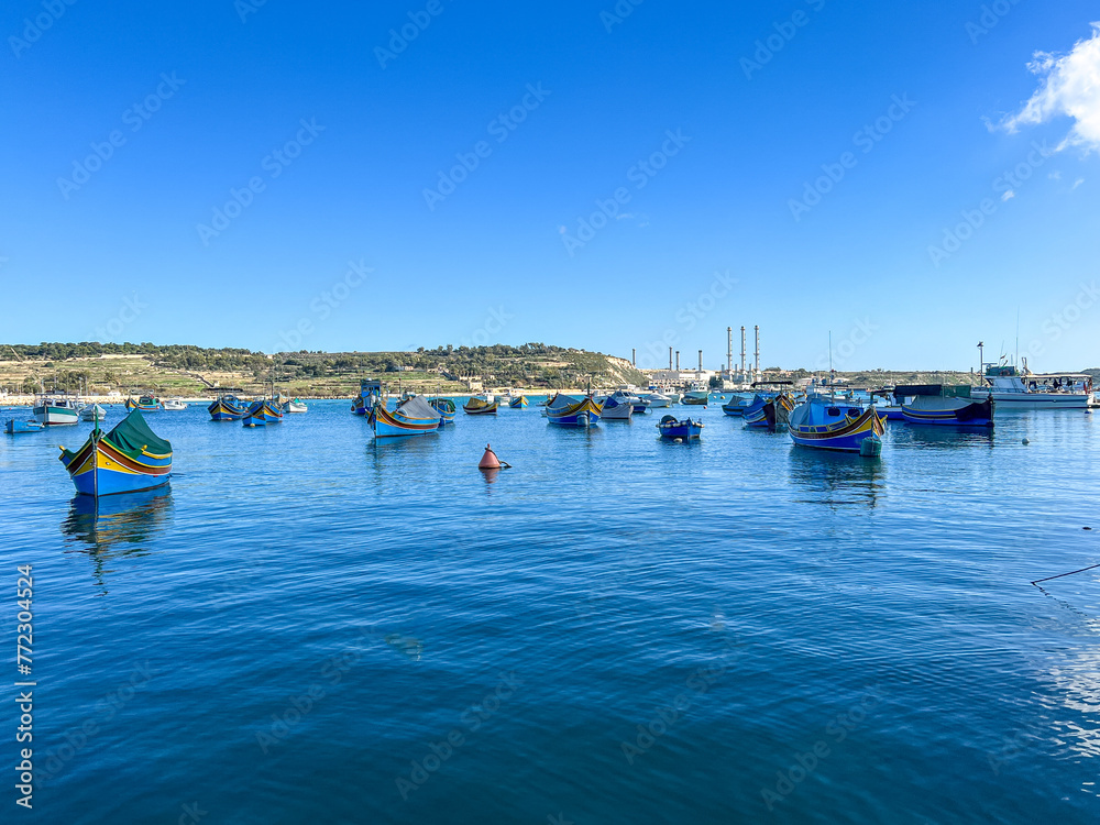 Fishing boats in the harbor of Marsaxlokk, Malta in a beautiful sunny day